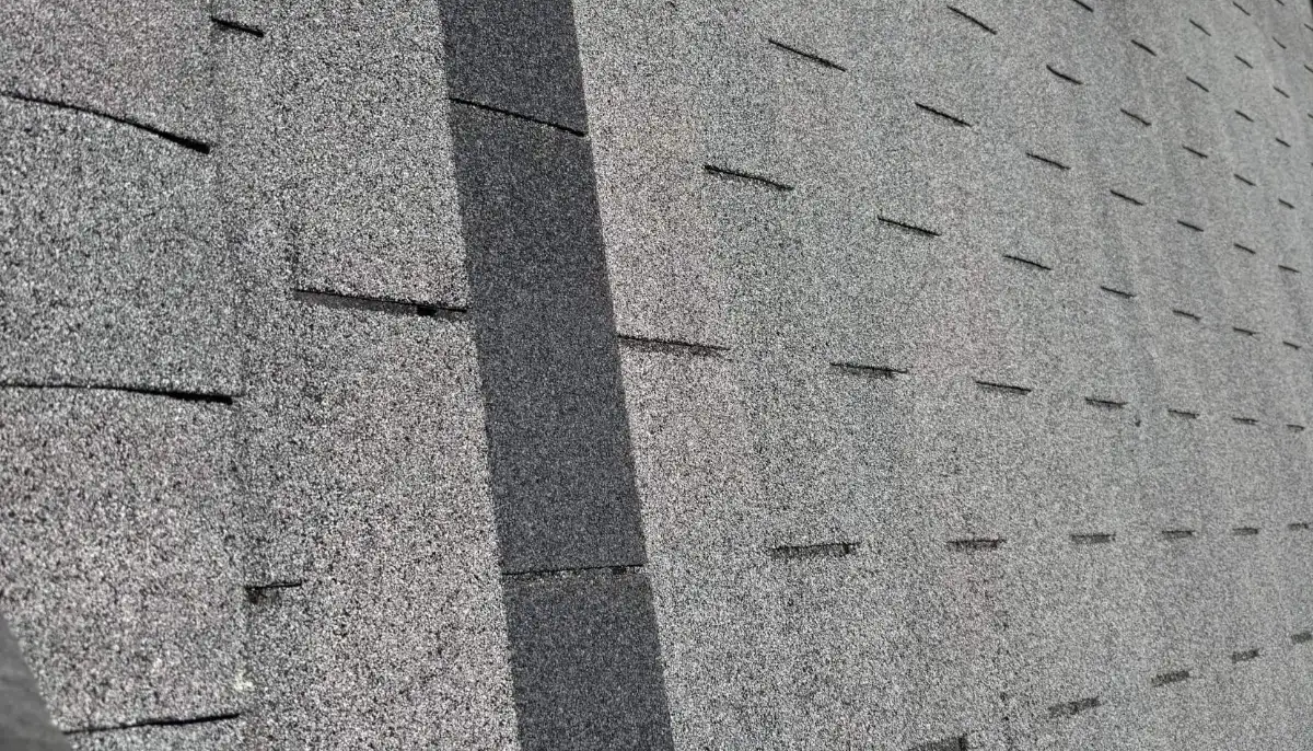 Close-up of architectural asphalt shingles and ridge cap