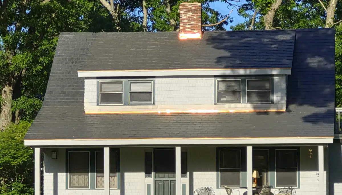 Finished roof with copper drip edge on a dormered Cape