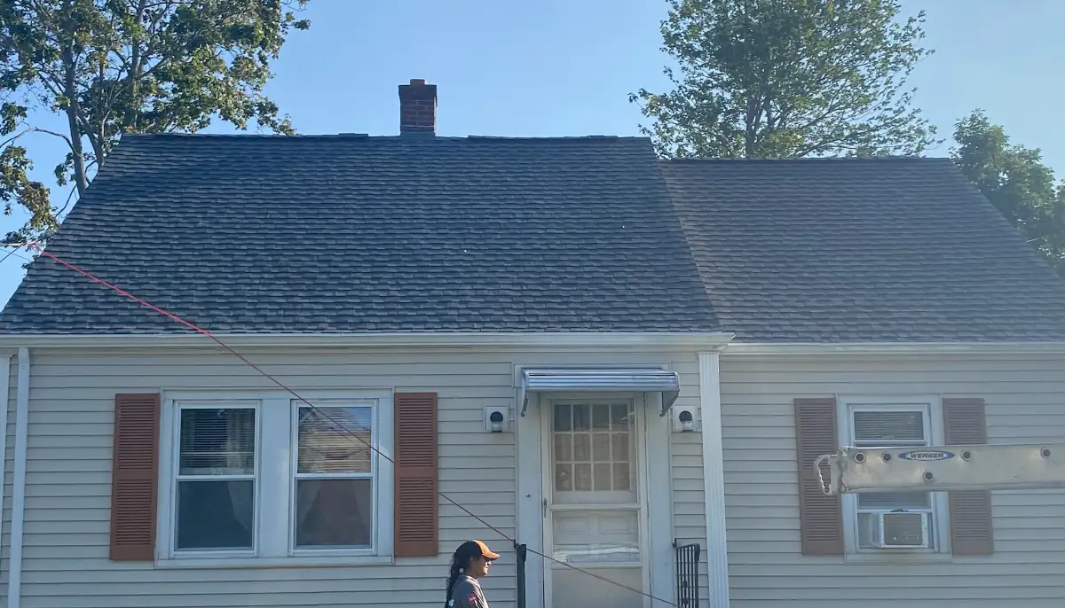 After: new architectural shingle roof on a Cape-style home