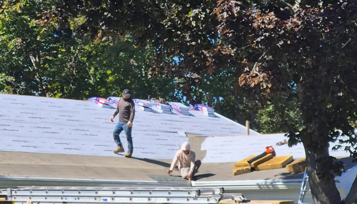 Roof replacement in progress with synthetic underlayment